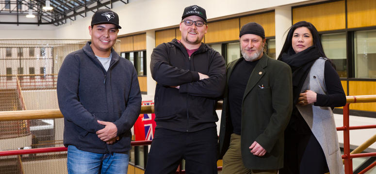 Assistant professor David Lertzman, third from left, stands with students Richard Sparvier, Joshua Haley, and Katrina Harding-Saddleback.