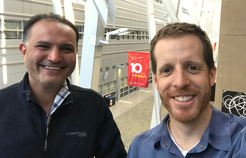 A photo of two men who comprise the MOUNT team, smile at the camera.