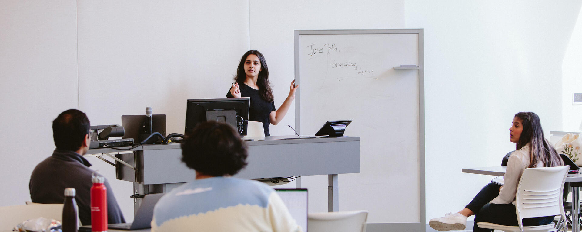 An instructor teaches in a TI classroom