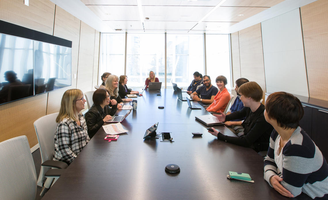 People sitting at a table in a meeting room