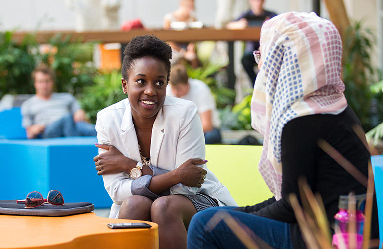 Photo of students Students talking to each other