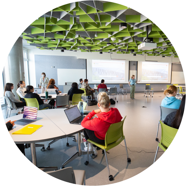 Students sitting together in a Hunter Student Commons classroom