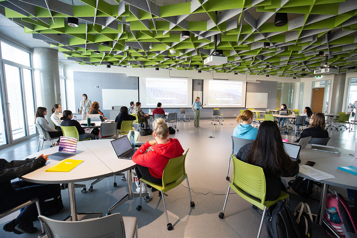 Students sitting together in a Hunter Student Commons classroom