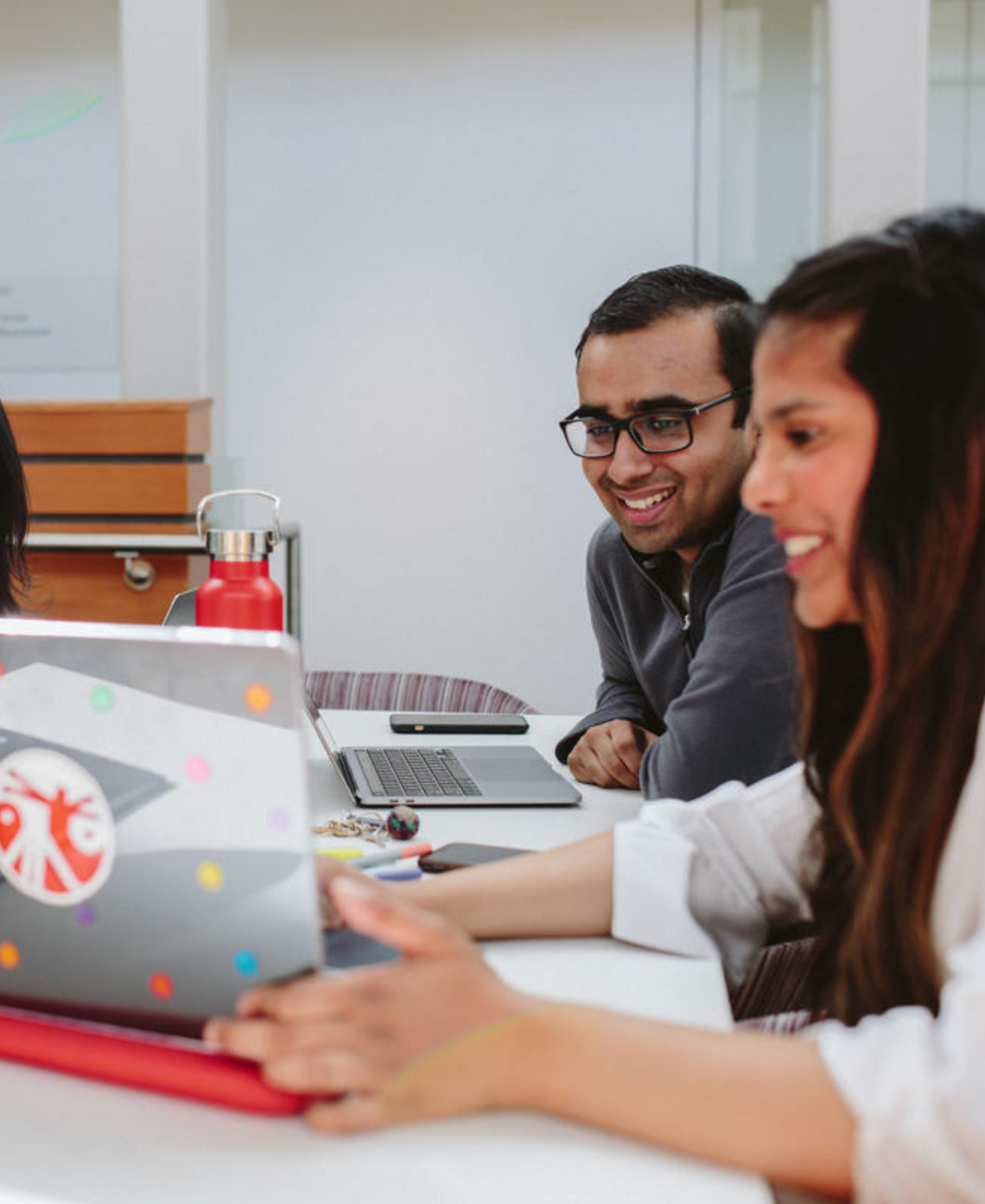 Two students collaborate on a project in a classroom